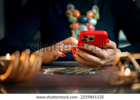 A tarot reader conducts an online consultation on tarot cards Royalty-Free Stock Photo #2259841135