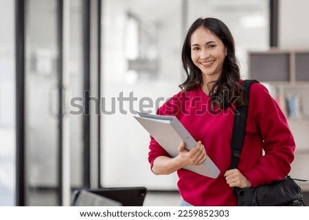 Portrait of Cheerful Indian beautiful Asian female female student enhancing her future by attending regular lectures