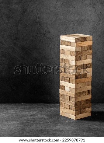 block wooden game on black background