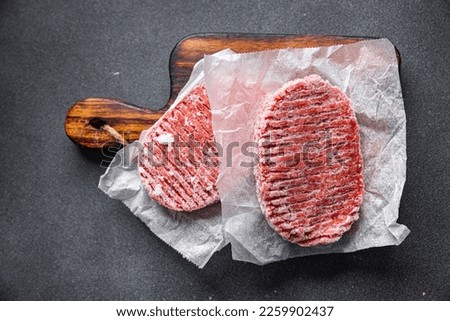 meat cutlet frozen minced meat pork, beef, chicken semifinished meal food snack on the table copy space food background rustic top view Royalty-Free Stock Photo #2259902437