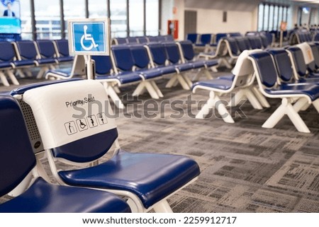 Airport seats, passenger seats, special seats Empty metal chair in the airport waiting room furniture pictures Airport departure or arrival concept image.