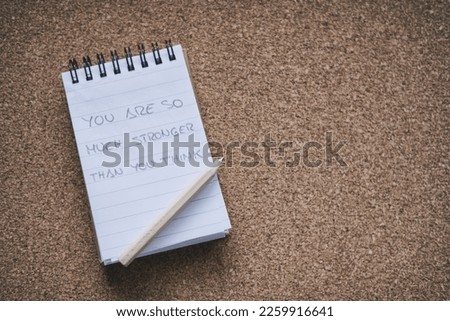 Handwritten Phrase On A Notepad, You Are So Much Stronger Than You Think. Motivation Concept