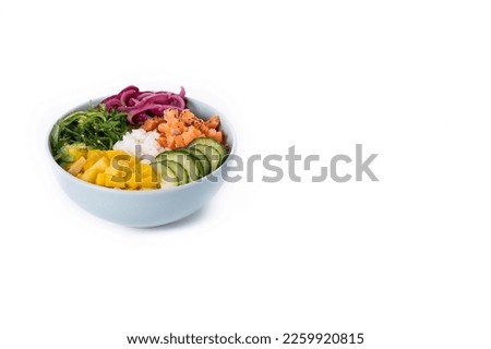 Poke bowl with rice, salmon,cucumber,mango,onion,wakame salad, poppy seeds ands sunflowers seeds isolated on white background. Copy space