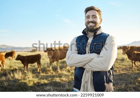 Farming, confidence and cows and portrait of man with smile on field, happy farm in countryside with dairy and beef production. Nature, meat and milk farmer, sustainable business in food industry. Royalty-Free Stock Photo #2259921009