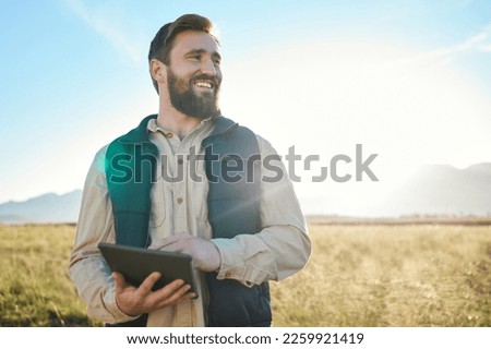 Research or agriculture man on tablet on farm for sustainability, production or industry growth analysis. Agro, happy or farmer on countryside field for weather, checklist or data search in Texas Royalty-Free Stock Photo #2259921419