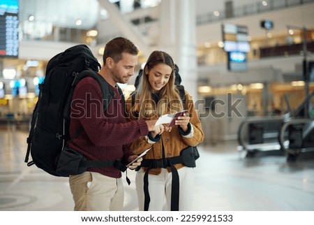 Love, couple and in airport with passport, traveling and check passport for information, airline and summer vacation. Romance, man and woman with happiness, holiday and confirm travel time and break Royalty-Free Stock Photo #2259921533