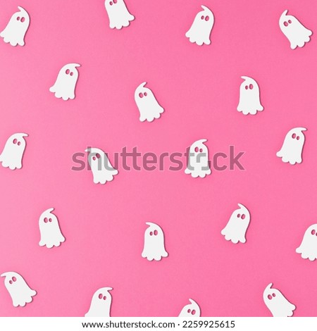 The white ghost pattern on the pink background  The Halloween concept  Flat lay