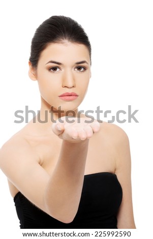 Young woman gesturing by hand