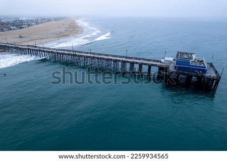 A drone shot of a metallic pier of the sea, cool for background