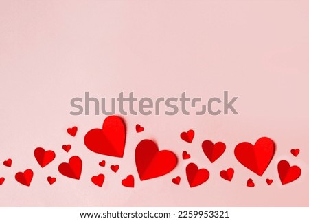 Paper hearts over the blue pastel background. Abstract background with paper cut shapes. Sainte Valentine, mother's day, birthday greeting cards, invitation, celebration concept Royalty-Free Stock Photo #2259953321