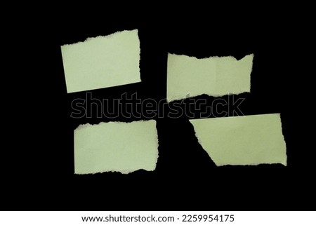 Torn paper piece isolated on black background. Ripped paper with copy space for text.