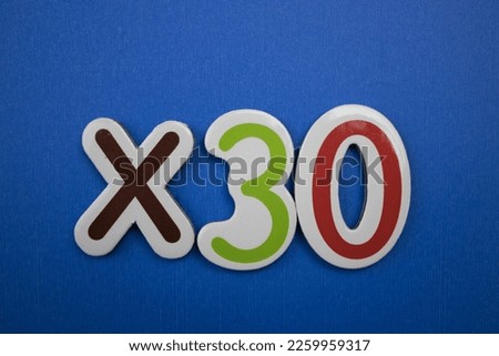 Colorful inscription ×30 placed on a blue background.
