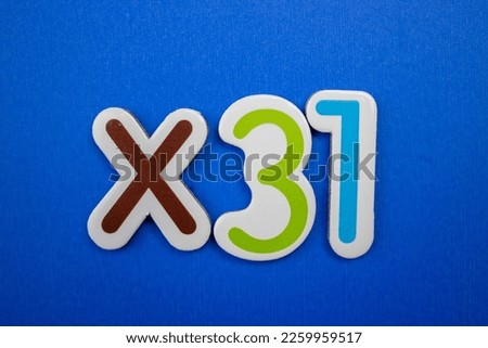 Colorful inscription ×31 over a blue background.