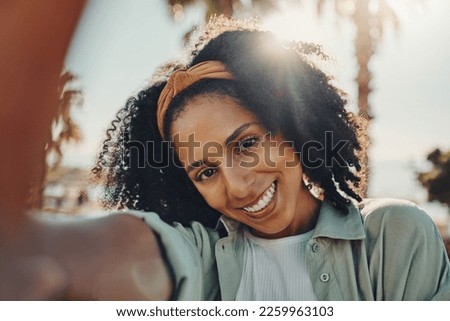 Portrait, selfie smile and happy black woman taking pictures to remember memory, social media or profile picture. Face, beauty and female from South Africa talking photo outdoors in nature or park.