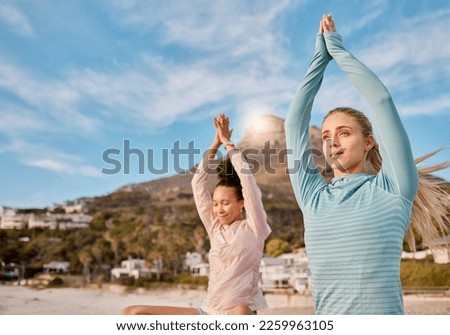 Yoga, mockup and meditation friends on the beach together for mental health, wellness or inner peace in summer. Exercise, diversity or nature with a female yogi and friend meditating outside Royalty-Free Stock Photo #2259963105
