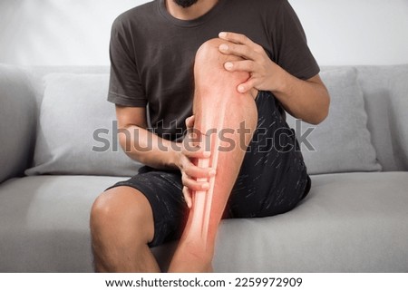 A man with a shinbone Fracture in an accident. Royalty-Free Stock Photo #2259972909