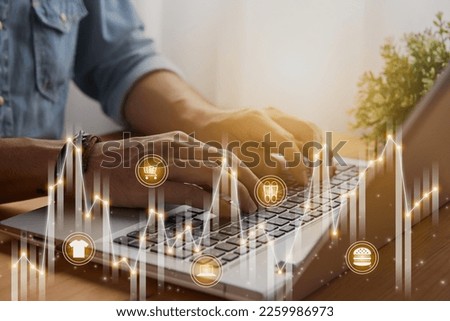 Casual Businessman Using or Typing Laptop and Online Product Icon,Stock Bar Chart,Line Graph Trend. Consumer Discretionary,Consumer Staples Sector,Financial,Economy Concept