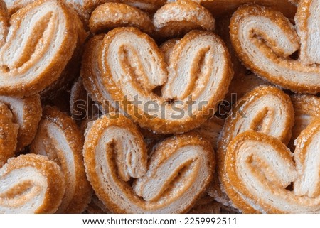 Pastry texture of puff pastry and sugar lenses Royalty-Free Stock Photo #2259992511
