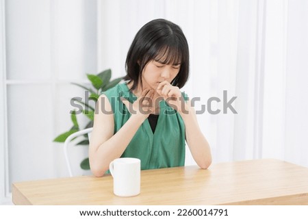 young woman with sore throat Royalty-Free Stock Photo #2260014791