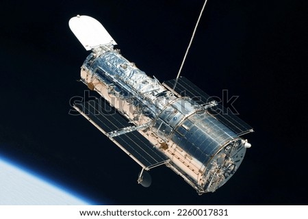 Space telescope above the surface of the planet. Elements of this image furnished by NASA. High quality photo