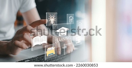 Concept of Online education. man use Online education training and e-learning webinar on internet for personal development and professional qualifications. Digital courses to develop new skills. Royalty-Free Stock Photo #2260030853