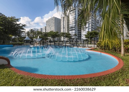 City of Santos, Brasil. Frog Fountain, beach gardens and waterfront buildings. Long exposition photography. 