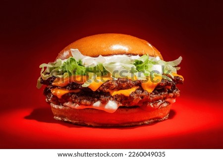 smash burger salad in red background Royalty-Free Stock Photo #2260049035