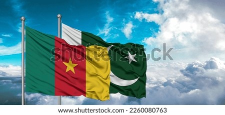 Flags of Pakistan and Cameroon friendship flag waving on the sky with beautiful sun light.