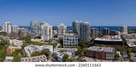 Aerial view of Miami Florida city skyline with modern buildings against sky. Beautiful landscape of downtown homes and skyscrapers with ocean view in the background.