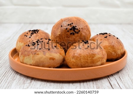 Homemade buns, pastries in a plate, on the table. pogaca