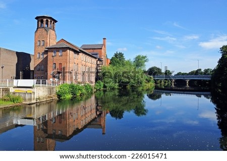 The Silk Mill alongside the River Derwent, Derby, Derbyshire, England, UK, Western Europe. Royalty-Free Stock Photo #226015471