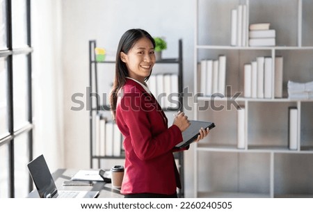 young confident businesswoman working in the office room, preparing for the meeting.