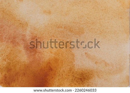 Abstract orange watercolor painting as background, top view