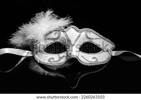 Carnival mask for Mardi Gras celebration on dark background