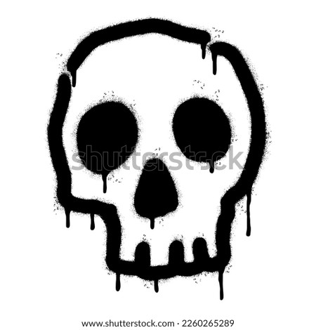 Spray Painted Graffiti skull icon Sprayed isolated with a white background. graffiti skull symbol with over spray in black over white.
