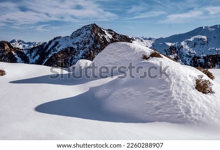 Snowdrifts in winter mountains. Winter snow mountains. Snowy mountains on winter landscape. Snowdrifts in snow mountains Royalty-Free Stock Photo #2260288907