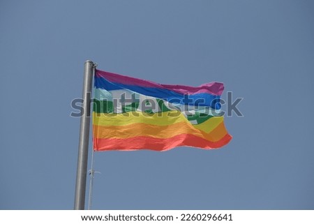 peace flag waving in the wind in sunny day. High quality photo