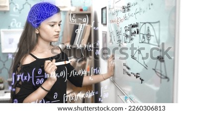 Indian teen student worried write formula think of sums, look on white board with marker pen at educational institute. Schoolgirl face problem while solving mathematics addition questions in classroom Royalty-Free Stock Photo #2260306813