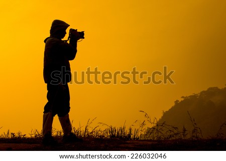Silhouette photographers take camera landscape in Phukaduang Nationala park Thailand
