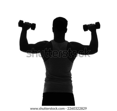 Silhouette of sporty young man with dumbbells on white background, back view