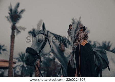 Saudi Foundation Day, the national day of the Kingdom of KSA, A Saudi man riding a horse and carrying a Saudi warrior's sword
Saudi heritage History of the Kingdom of KSA Royalty-Free Stock Photo #2260324909