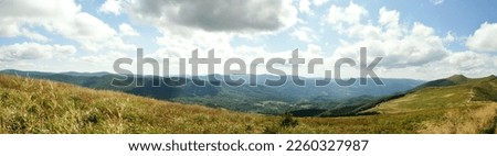 Panoramic picture of Bieszczady mountains, Bieszczady National Park, empty road leading towards mountain peaks beauty in nature