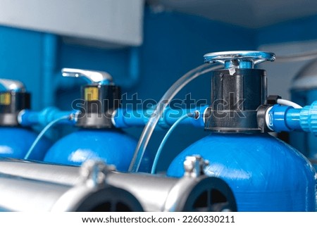 Sand leach, carbon filter or softener component of a reverse osmosis water station for a water refilling business. Royalty-Free Stock Photo #2260330211