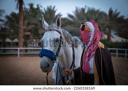 Saudi Foundation Day, the national day of the Kingdom of KSA, A Saudi man riding a horse and carrying a Saudi warrior's sword
Saudi heritage History of the Kingdom of KSA Royalty-Free Stock Photo #2260338169