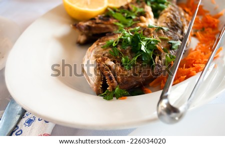 Seabass fish with lemon and carrot