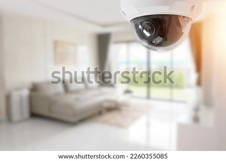 Living room interior with comfortable sofa, view through CCTV security camera Royalty-Free Stock Photo #2260355085
