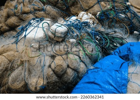 Nets for fishing belonging to fishermen on baron beach, folded up because they are not being used.