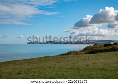 the canal between france and england near calais called the opal coast with grass coast and mountains Royalty-Free Stock Photo #2260381673