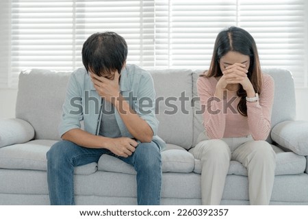 Divorce. Asian couples are desperate and disappointed after marriage. Husband and wife are sad, upset and frustrated after quarrels. distrust, love problems, betrayals. family problem, teenage love Royalty-Free Stock Photo #2260392357