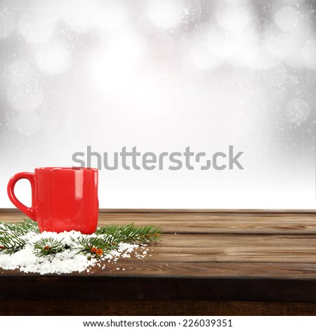 red mug and tree with snow 